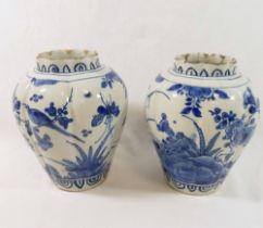 A pair of 18th century Dutch Delft lobed baluster vases, decorated with ducks and birds amongst
