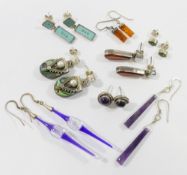 Eight pairs of earrings, comprised of a pair of amethyst drop earrings and a pair of amethyst stud