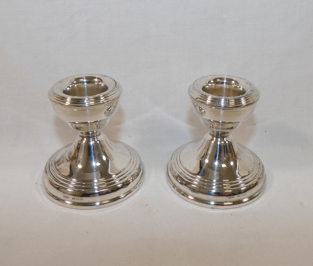 A pair of squat silver candlesticks, Birmingham 1964, filled, with circular bases, 5.8cm high - Image 2 of 2