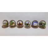 A set of six Sampson Mordan and Co. silver and enamel menu holder/place settings, each decorated