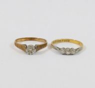 An 18 carat gold diamond three stone ring, the round brilliant cut stones combined weight