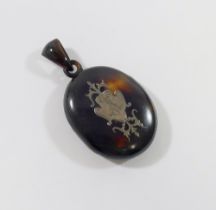 A Victorian silver inlaid oval tortoiseshell locket, 5cm x 4cm with tortoiseshell bail  CONDITION