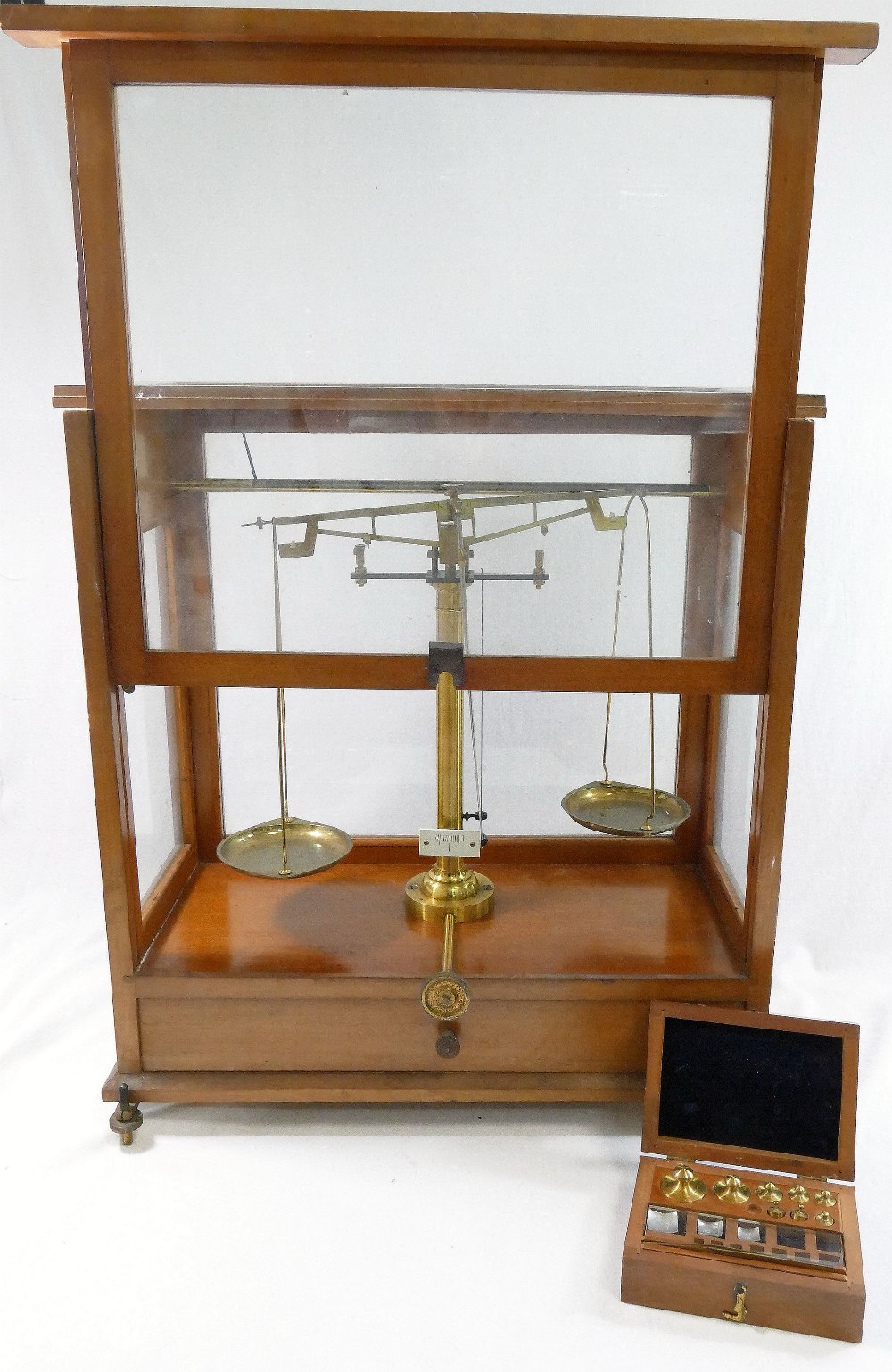 A set of early 20th century brass apothecary/precision scales, housed in glazed wooden case, with - Image 3 of 3