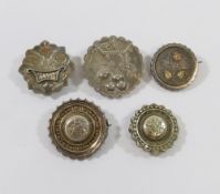 Twelve Victorian and early 20th century silver and silver coloured metal brooches, five with