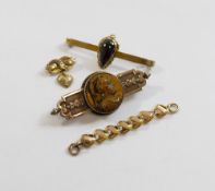 A Victorian brooch set with circular tiger's eye carved in relief with the head of a Centurion,