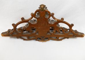 A 19th century Black Forest carved wooden pipe rack, with fern leaf decoration, 37cm wide