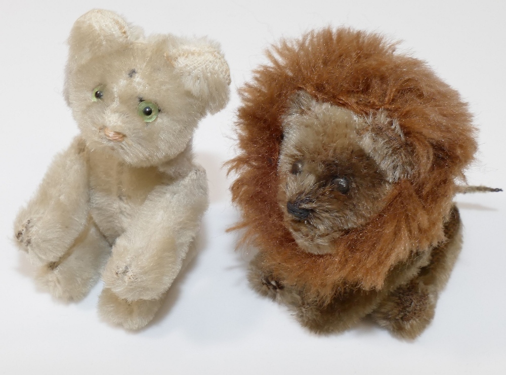A miniature Steiff lion, 9.5cm long, and a faded miniature Steiff tiger, 9cm long, tail lacking - Image 2 of 3