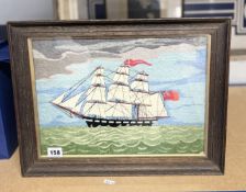 An old woolwork picture depicting a sailing ship with a British flag, glazed and framed, overall