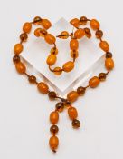 A bead necklace set with a mixture of amber beads, length 36cm.