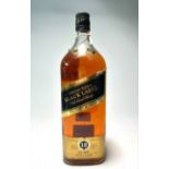 A bottle of Johnnie Walker Black Label Old Scotch Whisky, ”Extra Special,” distilled, blended and