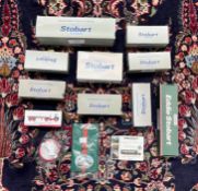 A collection of 10 Eddie Stobart model trucks together with a tin of Eddie Stobbart drinks mat's.