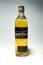 A bottle of Paul Chapman Whisky de Luxe, pure grain and malt blend, made in France, distressed