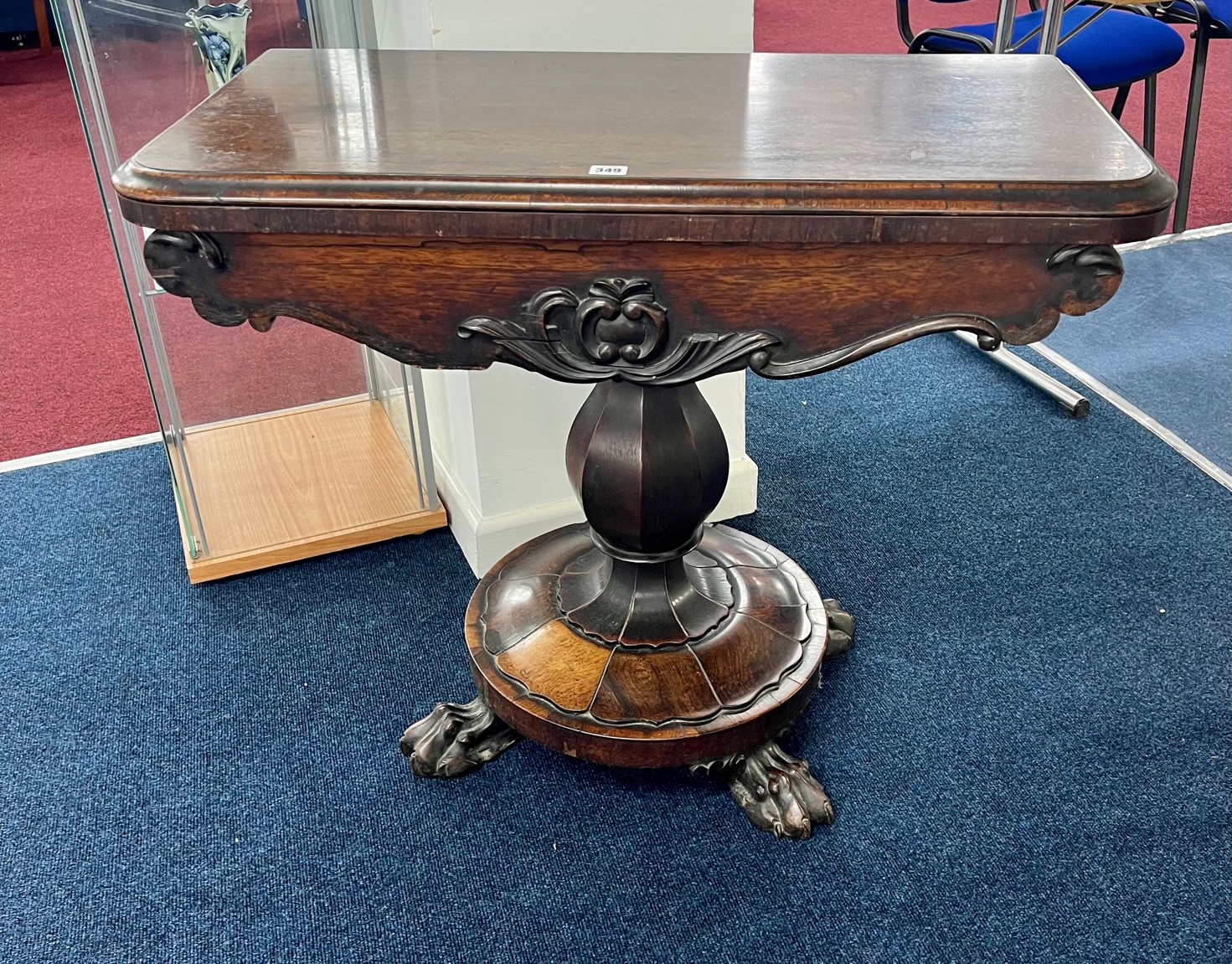 A Victorian rosewood fold over card table on pedestal base.