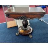 A Victorian rosewood fold over card table on pedestal base.