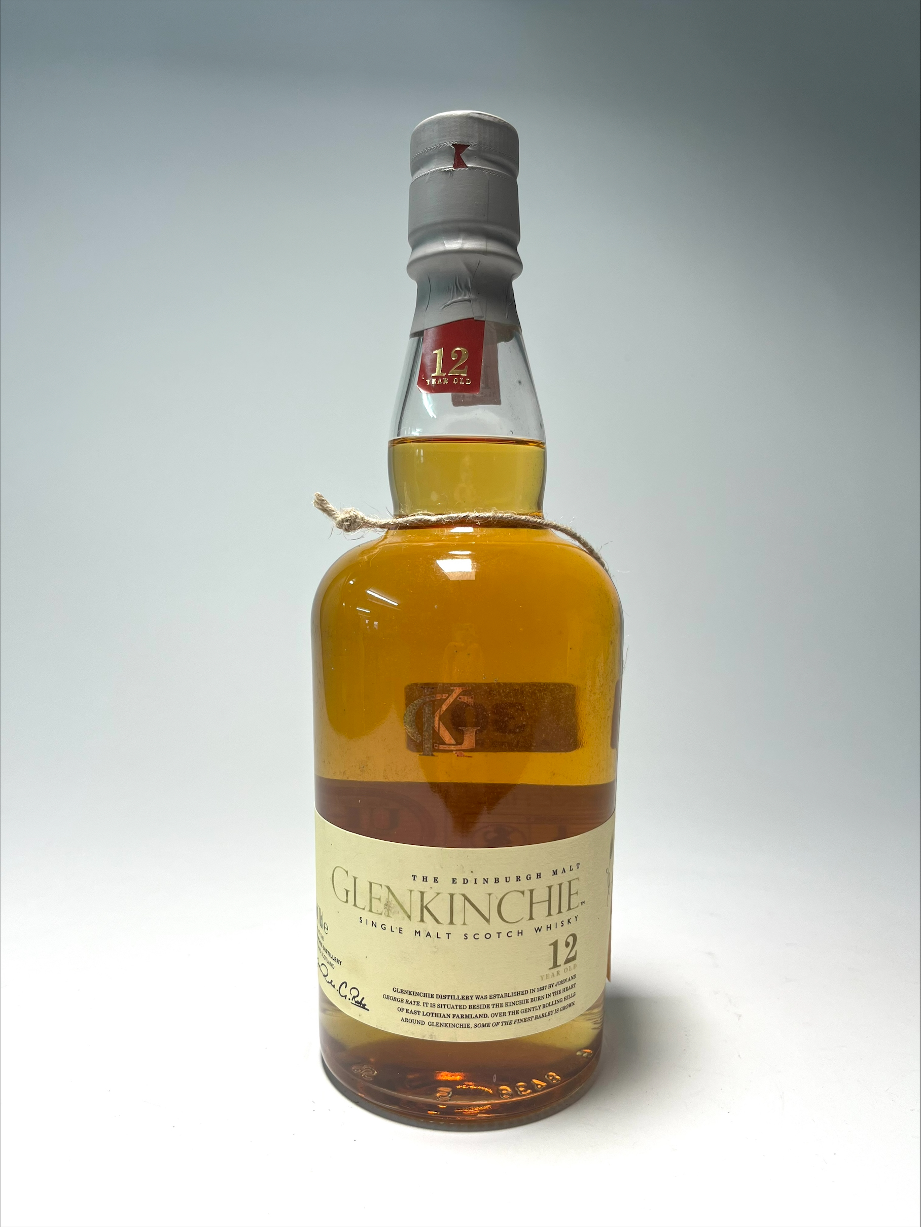 A bottle of The Edinburgh Malt Glenkinchie Single Malt Scotch Whisky, aged 12 years, distilled at