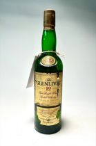 A bottle of Glenlivet Pure Single Malt Scotch Whisky, aged 12 years, distilled in Scotland,