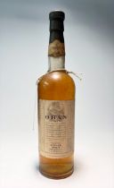 A bottle of Oban Single Malt Scotch Whisky, aged 14 years, distilled in Scotland, distressed