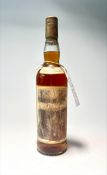 A bottle of The Macallan Sherry Oak Matured Whisky, aged 10 years, distressed label.