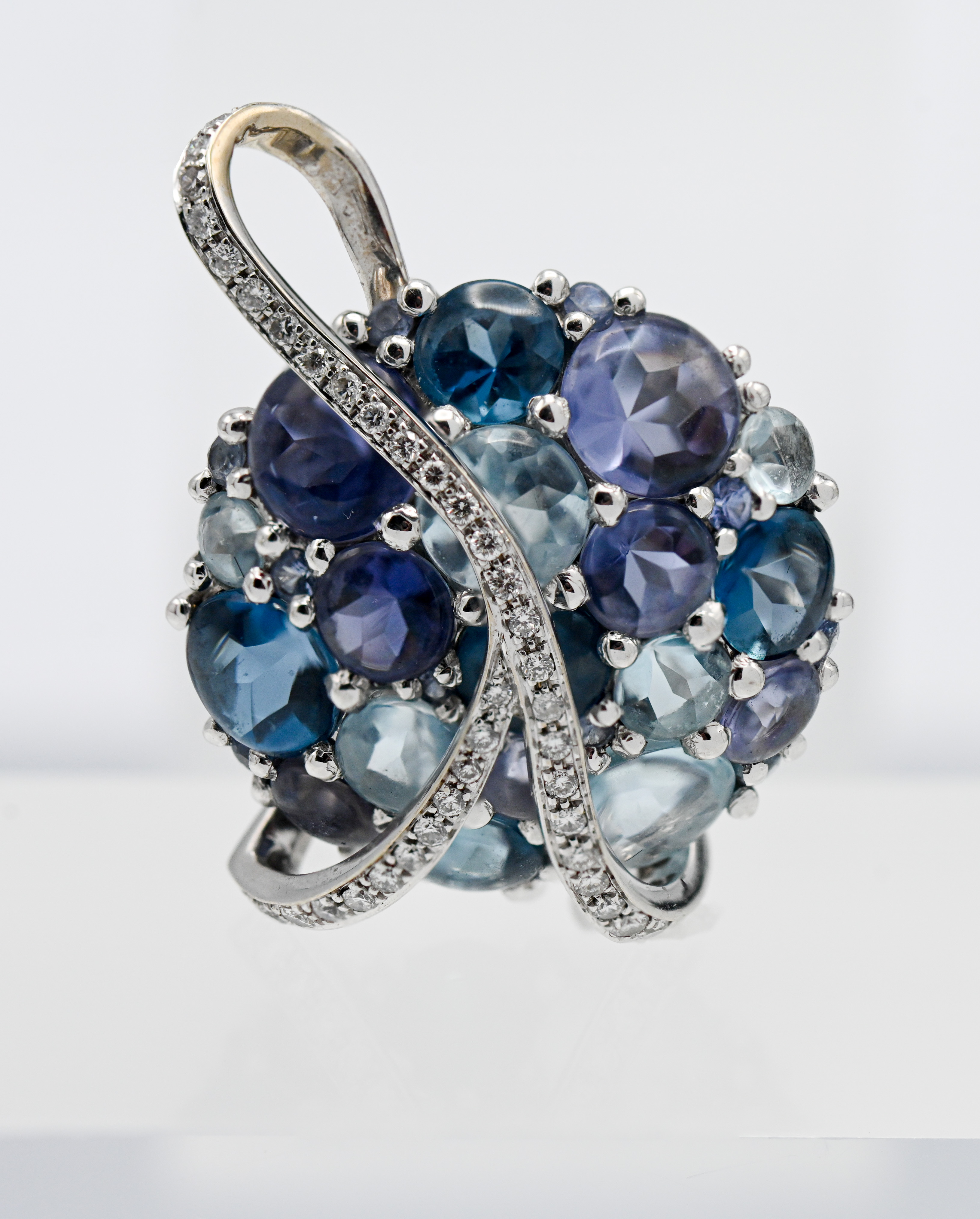 An impressive Tanzanite, Topaz, Aquamarine and Diamond pendant, set in 18ct white gold.