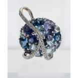 An impressive Tanzanite, Topaz, Aquamarine and Diamond pendant, set in 18ct white gold.