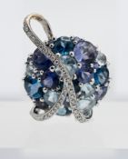 An impressive Tanzanite, Topaz, Aquamarine and Diamond pendant, set in 18ct white gold.