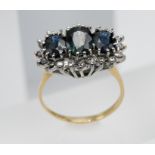 A large three stone sapphire and diamond cluster ring, set in 18ct yellow gold, size Q.