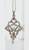 An Edwardian ruby, diamond and pearl set pendant on fine chain