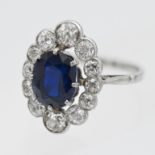 A fine diamond an sapphire cluster ring, 18mm x 14mm (head size), size L.