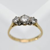 A diamond three stone ring, set in 18ct yellow gold, size R.