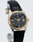 Rolex, a gents 1983 (Datejust), Model 16013, serial number 8014623, with gold bezel, black and white