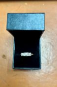 A three stone diamond ring, old cut diamonds in square frames, set in yellow gold, size R/S.