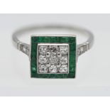 An emerald and diamond art deco square set ring, set in platinum, size N.