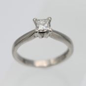 A diamond solitaire engagement ring, princess cut, set in platinum, size M.