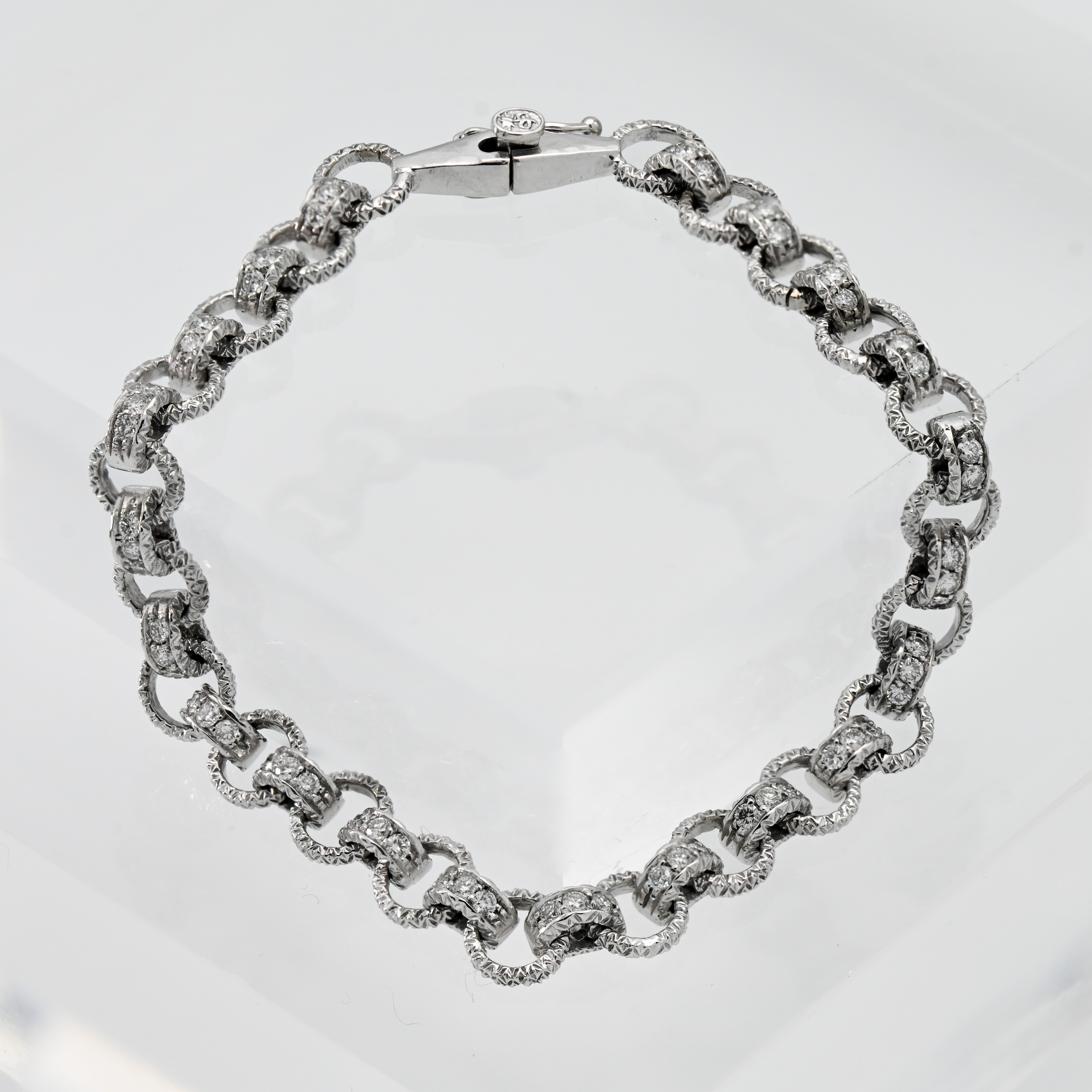 A good 18ct and diamond set hoop link bracelet, length approx. 20cm.