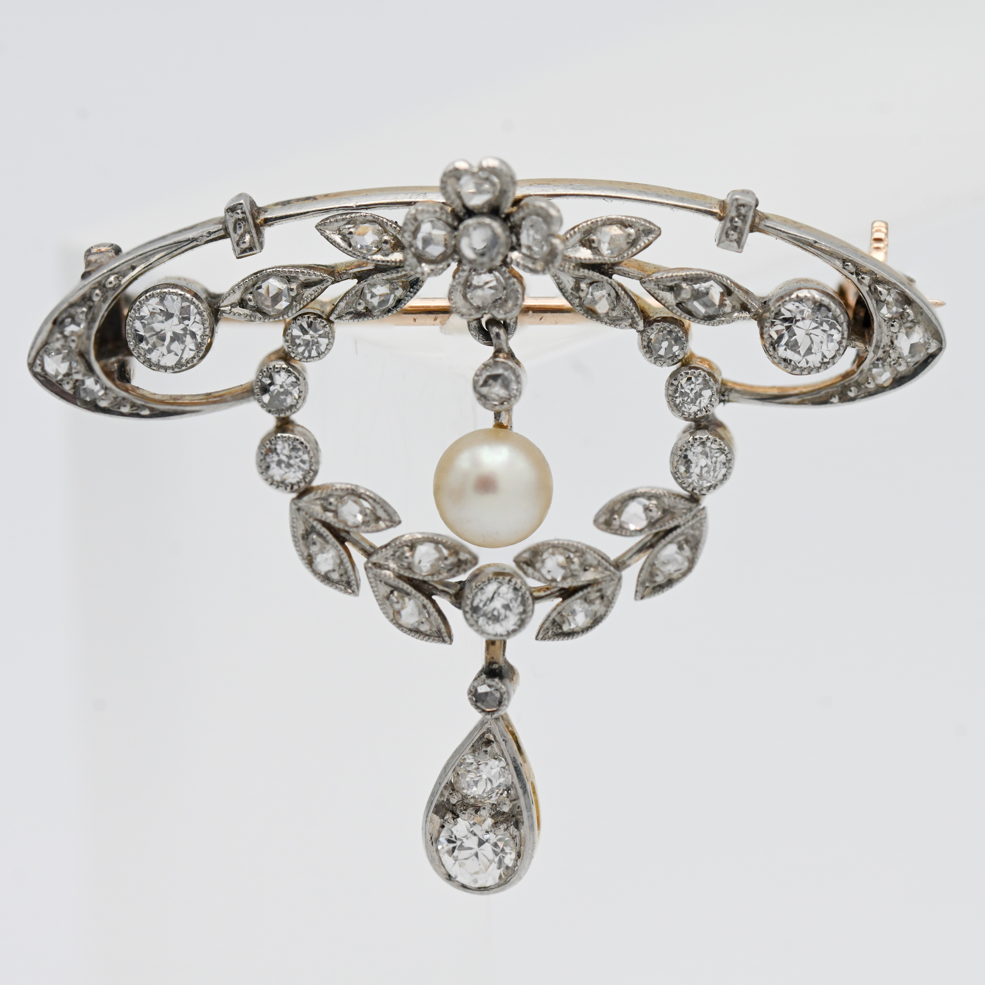 Edwardian diamond and pearl pendant brooch, set in yellow gold.