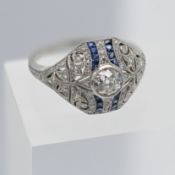 An art deco diamond and sapphire ring, marked Plat 0.51, 0.24, 0.25, set in platinum, size M/N.