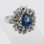 A large sapphire and diamond cluster ring, set 18k white gold, size L/M.