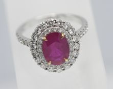 A beautiful ruby and diamond cluster ring, set in 18ct white gold, size N.