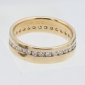 An 18ct yellow gold and diamond band ring, size P.