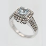 A 14ct white gold diamond and aquamarine cluster ring, size P.