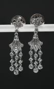 A good pair of diamond, fleur de lys earrings, set in 18ct white gold, length 32mm,.