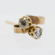 A pair of diamond stud earrings, set in yellow gold, marked 375.