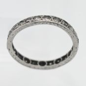 A diamond full band eternity ring, set in white metal (unmarked), size O.