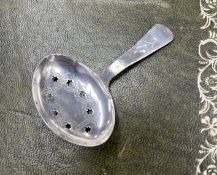 A George III silver caddy spoon, Birmingham hallmark, letter F, pierced stars and eight leaf