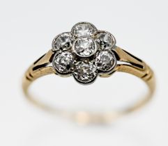 An antique 18ct yellow gold diamond set 'Daisy' style flower ring, size L.