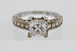 14kt white stone dress ring Central 7.00 x 7.00mm Princess cut stone with 5 x 2.5mm princess