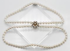 A two row uniform cultured pearl necklace, approx. Pearl size: 8.00mm, approx. length: 42cm, with