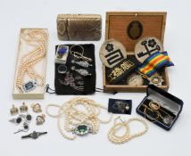 A collection of costume jewellery including pearls, brooches etc