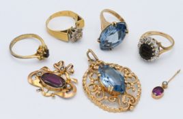 A 9ct gold sapphire and diamond ring, a 9ct gold and blue stone pendant, a 9ct gold and blue stone