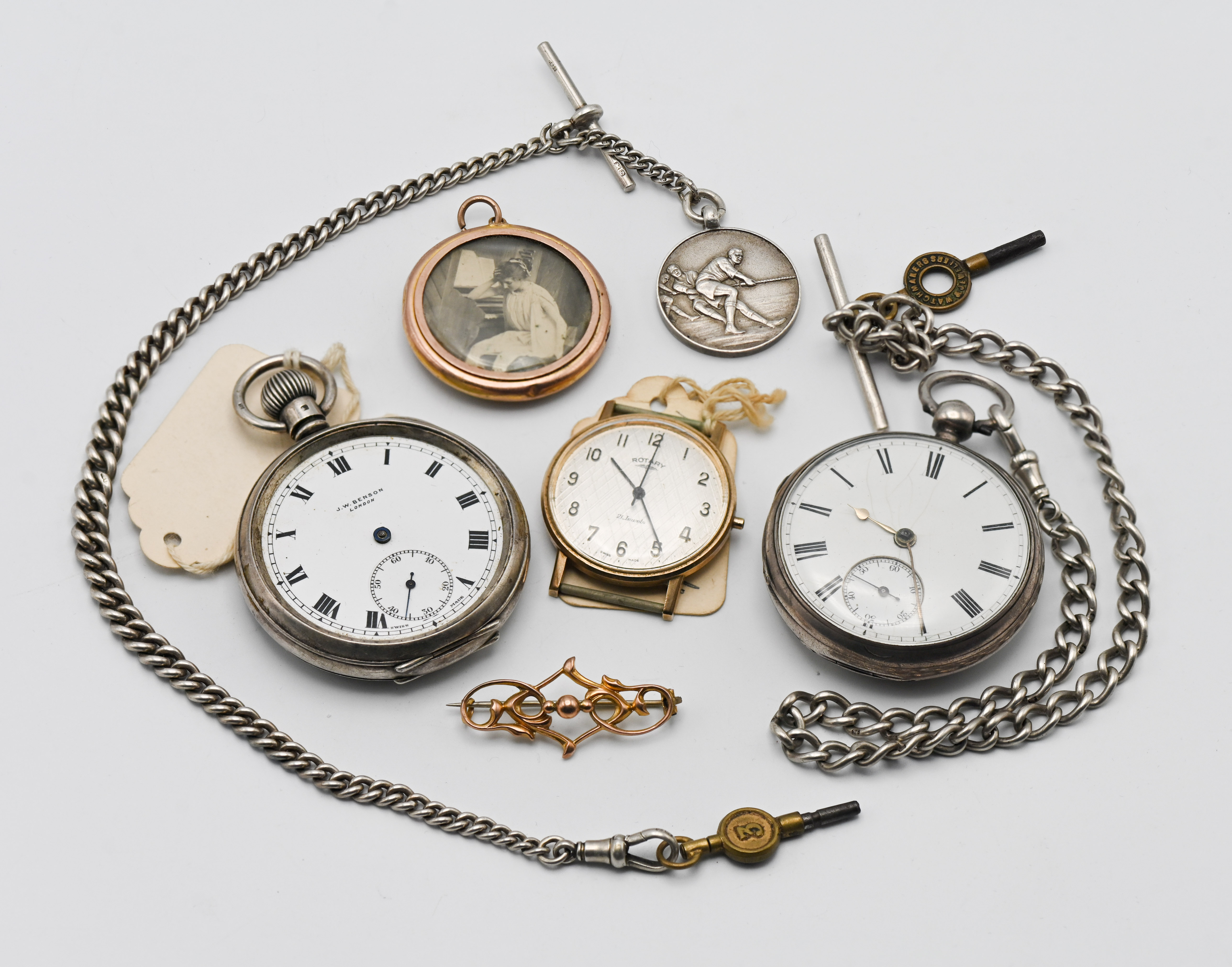 A mixed collection including a J.W. Benson pocket watch, a silver pocket watch on a silver watch